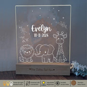 a Baby Night Light with a picture of a giraffe, a lion and a elephant