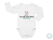 a white long sleeved bodysuit with the words sugar and spice on it