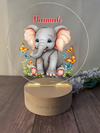 a glass plate with a picture of a baby elephant