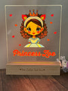 a glass plaque with a picture of a princess on it