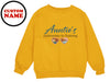 a yellow sweatshirt with an image of two hearts on it