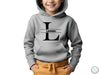 a young boy wearing a hoodie with the letter l on it