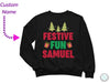 a black sweatshirt with festive fun samuel on it