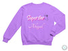 a purple sweatshirt with the words superstar and a microphone