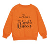 an orange sweatshirt with the words ana&#39;s sparkle queen printed on it